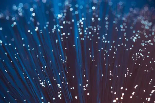 Image of a close-up view of a fiber optic cable, featuring DataField Technology Services and highlighting fiber optic termination methods.