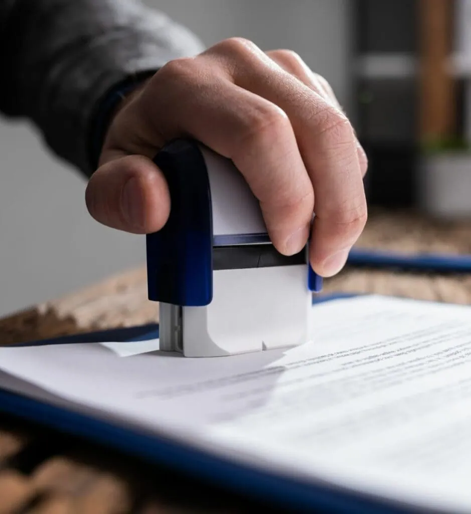 A person is holding a stamper over a piece of paper, featuring Data Field Technology Services and highlighting their expertise in innovative tech solutions.