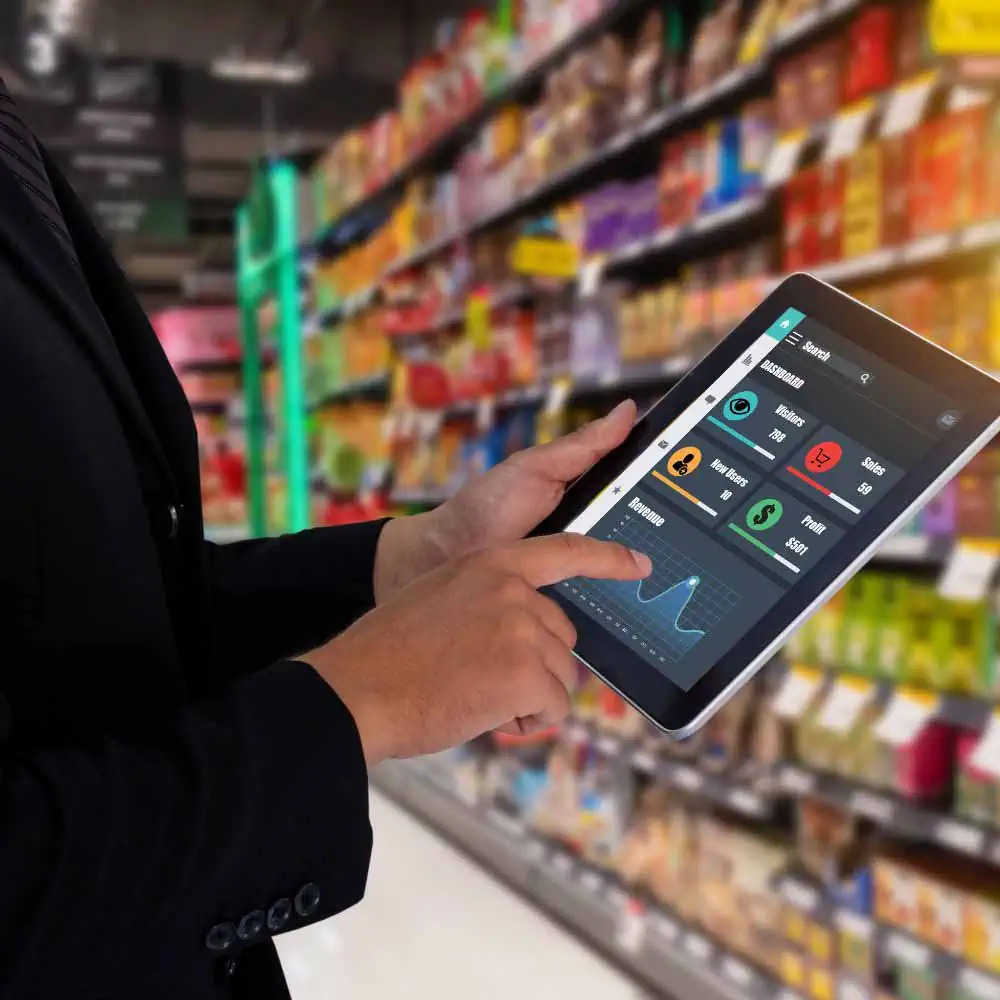 Image portraying a hand touching a tablet, featuring DataField Technology Services and emphasizing Retailers, ensuring alignment with the page's context.