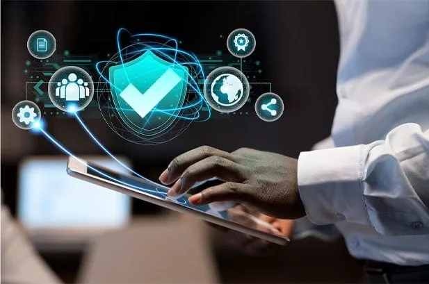 Hand interacting with a tablet, spotlighting Datafield Technology Services, and underlining The Importance of Network Security in Telecom, harmonizing with the page's context.