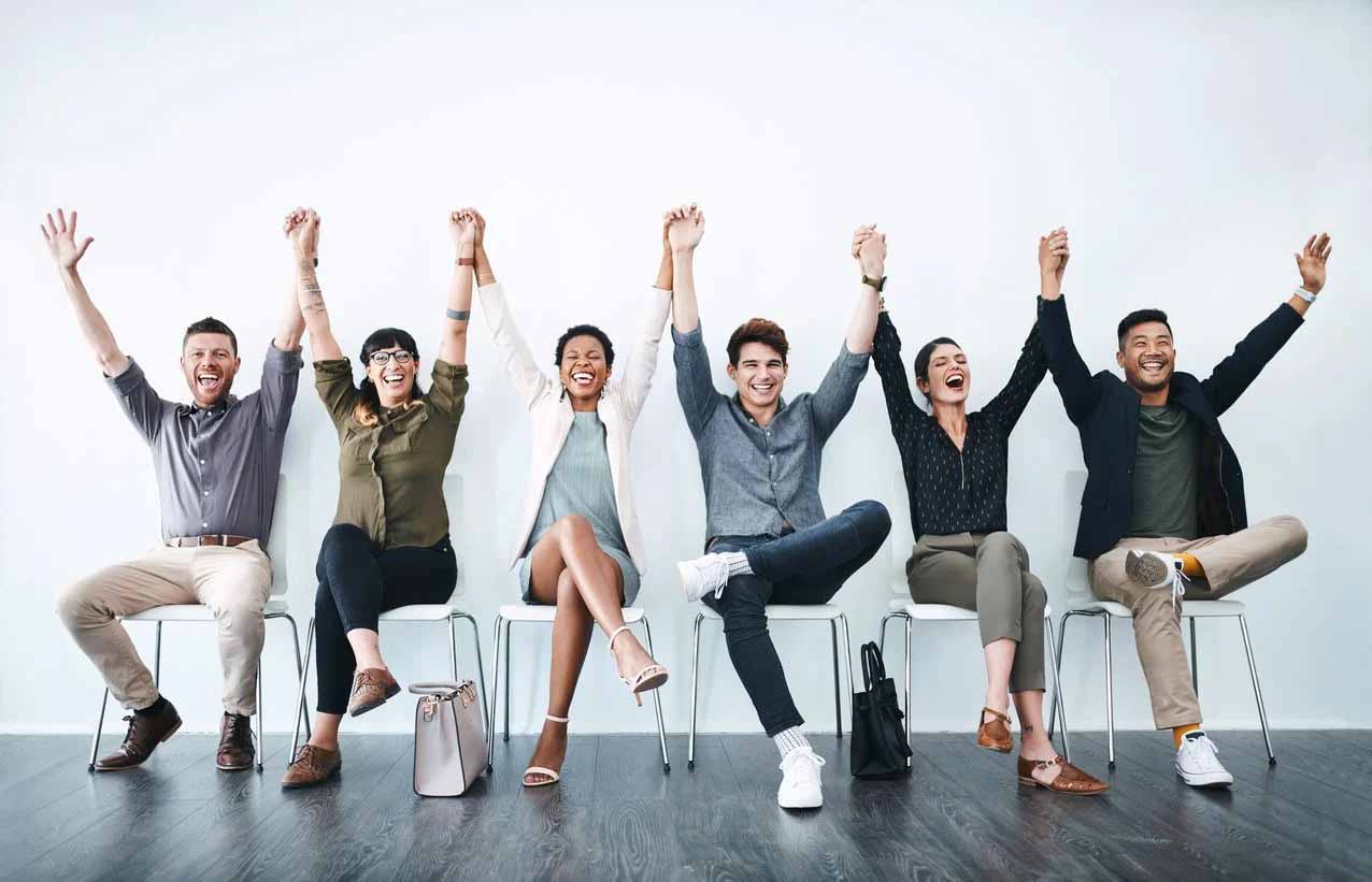 Group raising both hands up, featuring Datafield Technology Services, and highlighting The Key to Superior Staffing Solutions, perfectly aligned with the page's context.