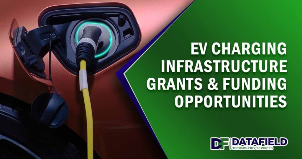 Image of a close-up hand gripping the plug of an industrial electric charging machine connected to a vehicle, featuring Datafield Technology Services and highlighting EV Charging Infrastructure Grants & Funding Opportunities, ensuring it aligns with the page's context.