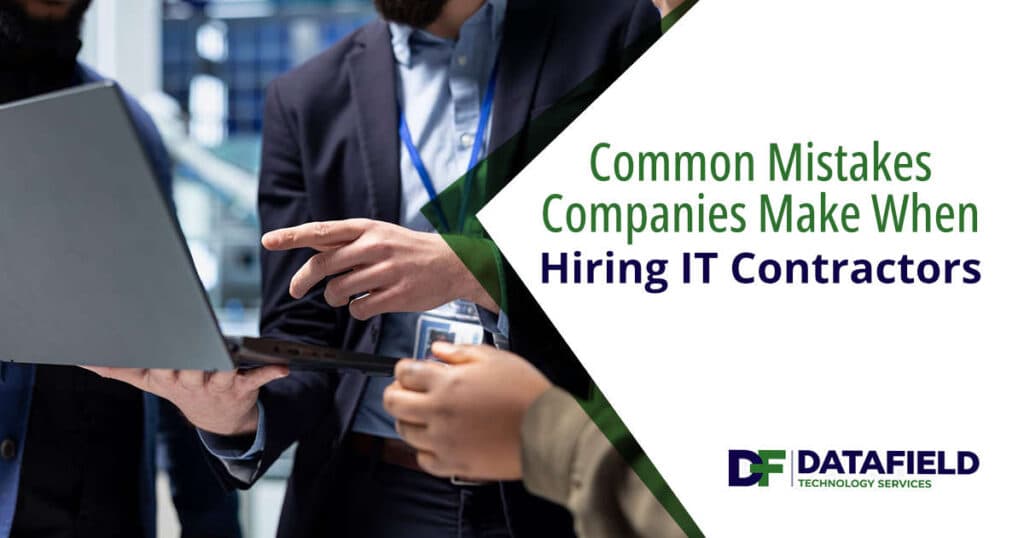Multiethnic IT technicians and building contractors analyzing project data together, representing DataField Technology Services and highlighting common mistakes companies make when hiring IT contractors.